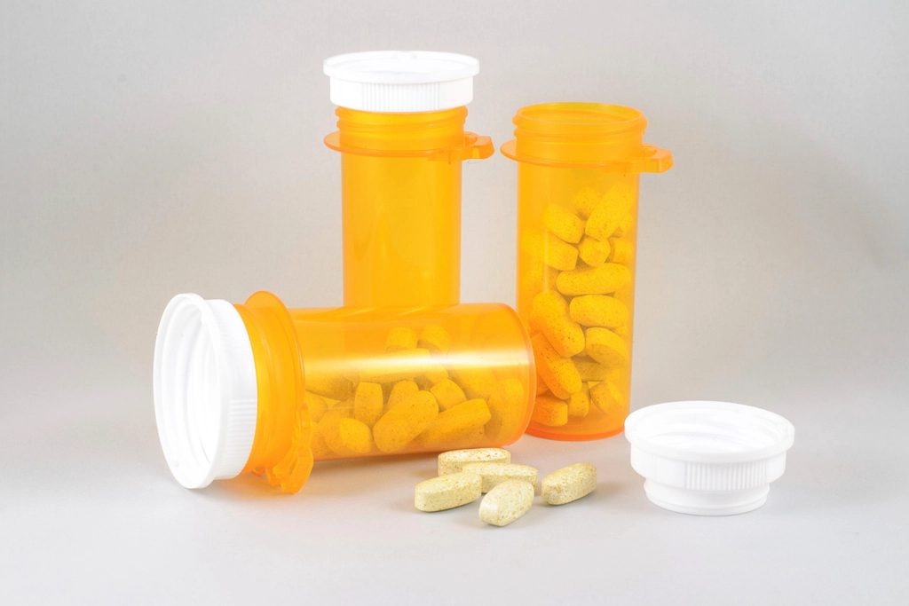 Prescription bottles with capsules and tablets